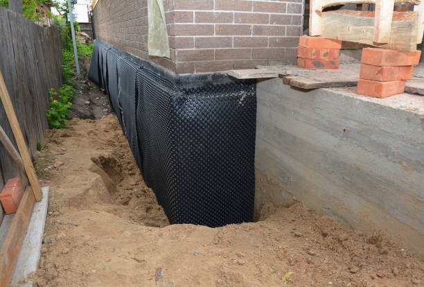 Happy homeowners after waterproofing job in Minster